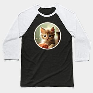 A playful kitten chasing a ball of yarn. Baseball T-Shirt